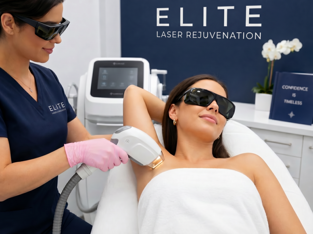 A professional scene showing a technician performing a laser treatment on a client's underarm.